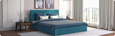 Bedroom with blue upholstered headboard